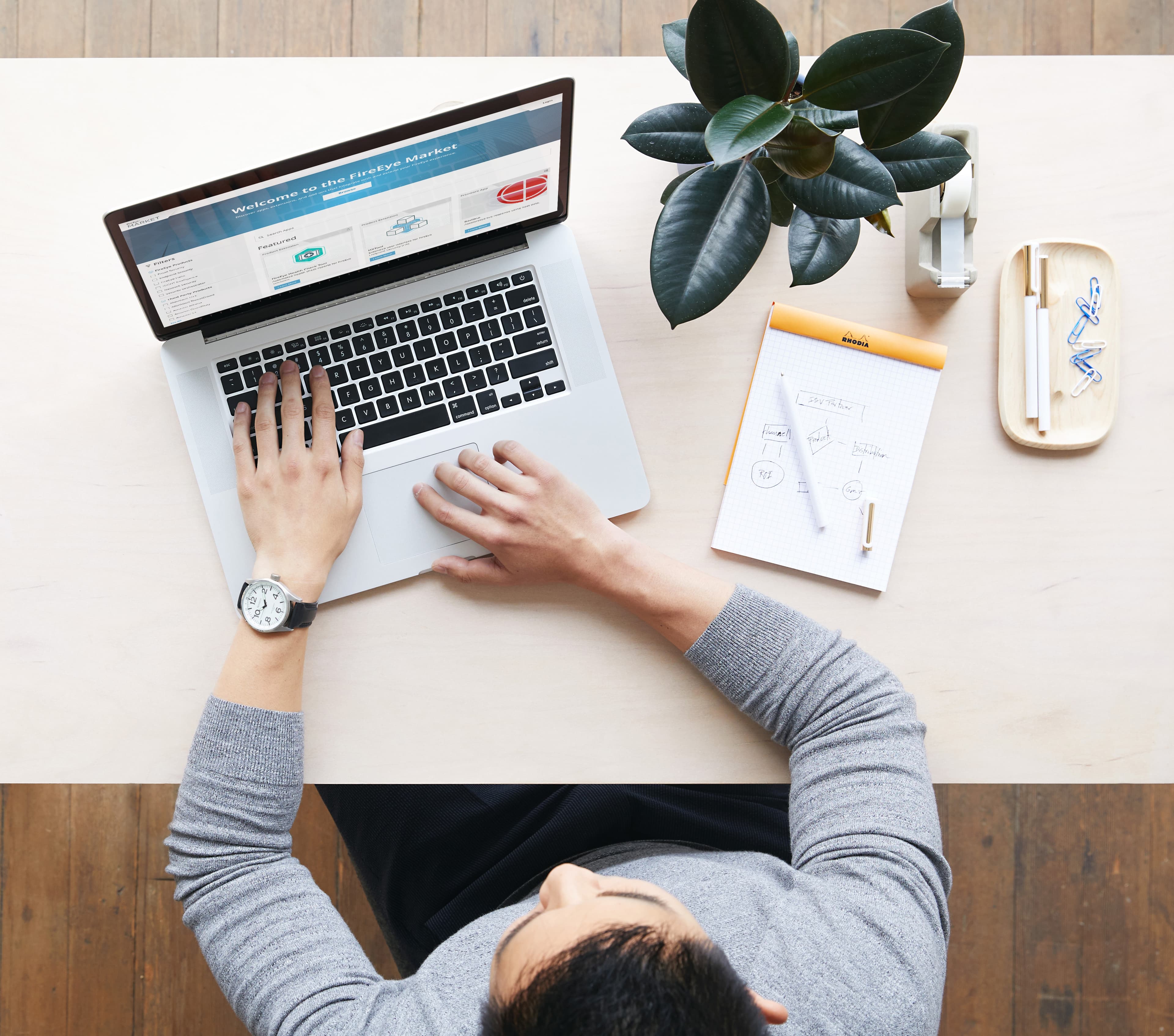 Bird's eye view of a laptop with the AppDirect platform on the screen